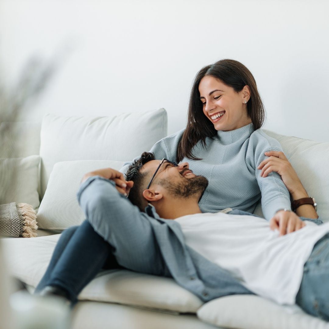 happy couple on couch