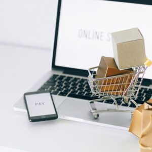 computer with a shopping cart next to it