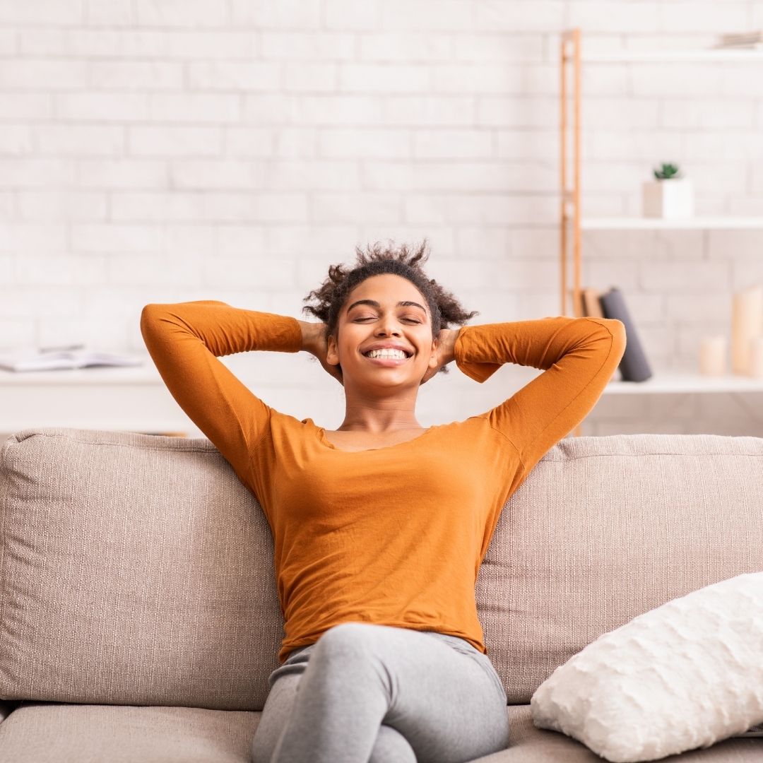 woman relaxing on couch