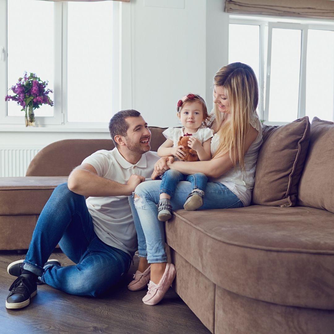 family sitting on couch