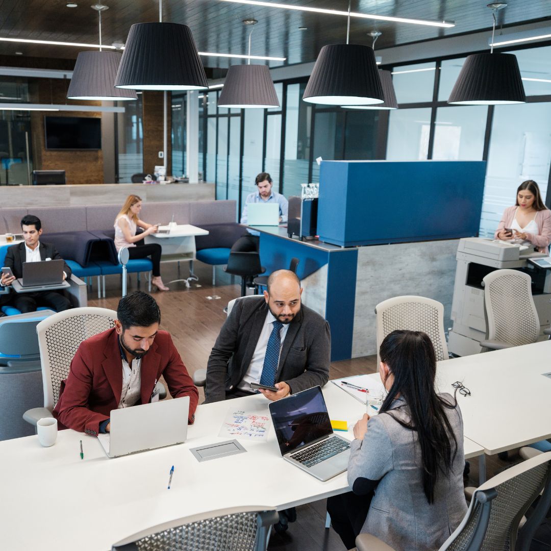 an office with many people working