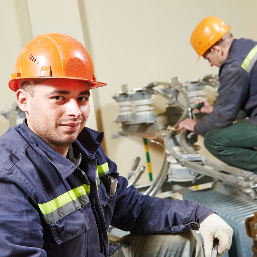 electricians smiling as they work