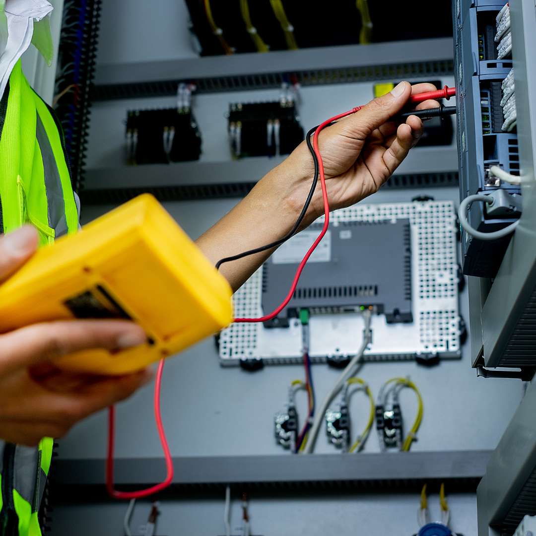 electrician inspecting equipment