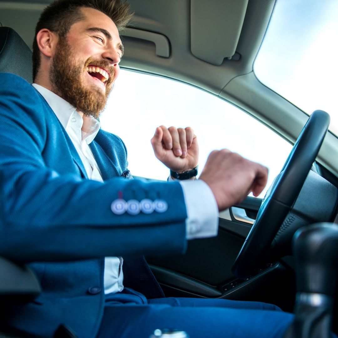 happy person driving electric car