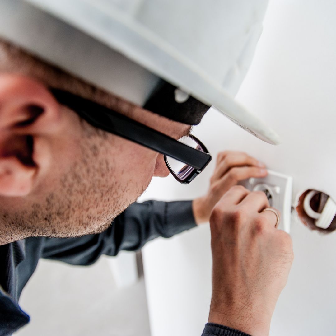 person looking at outlet