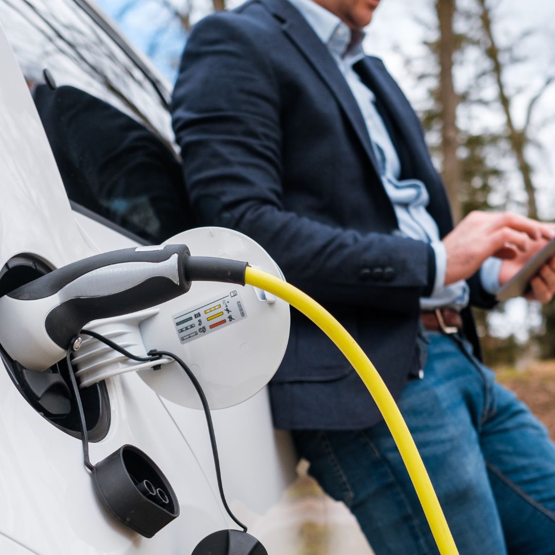 business worker charging their car