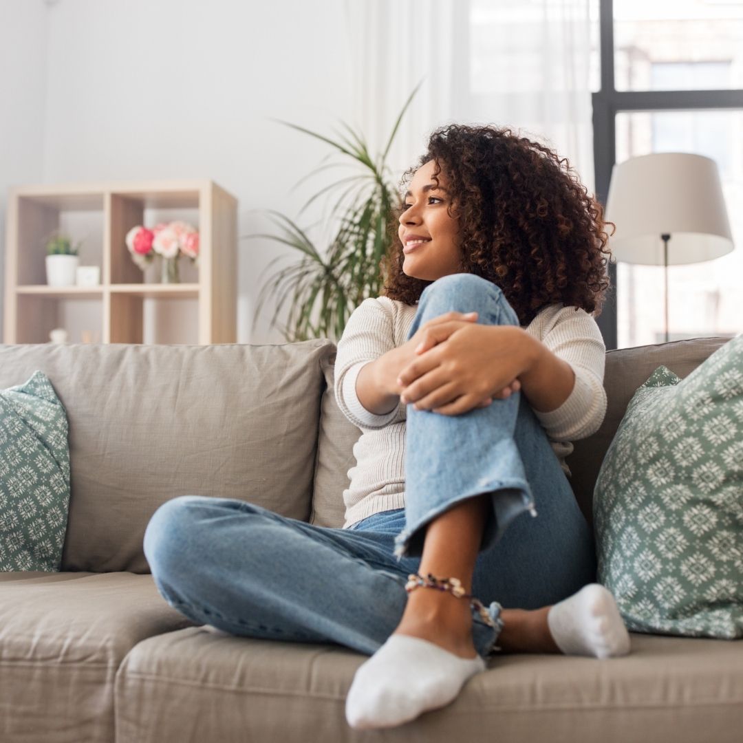 woman relaxing on couch 